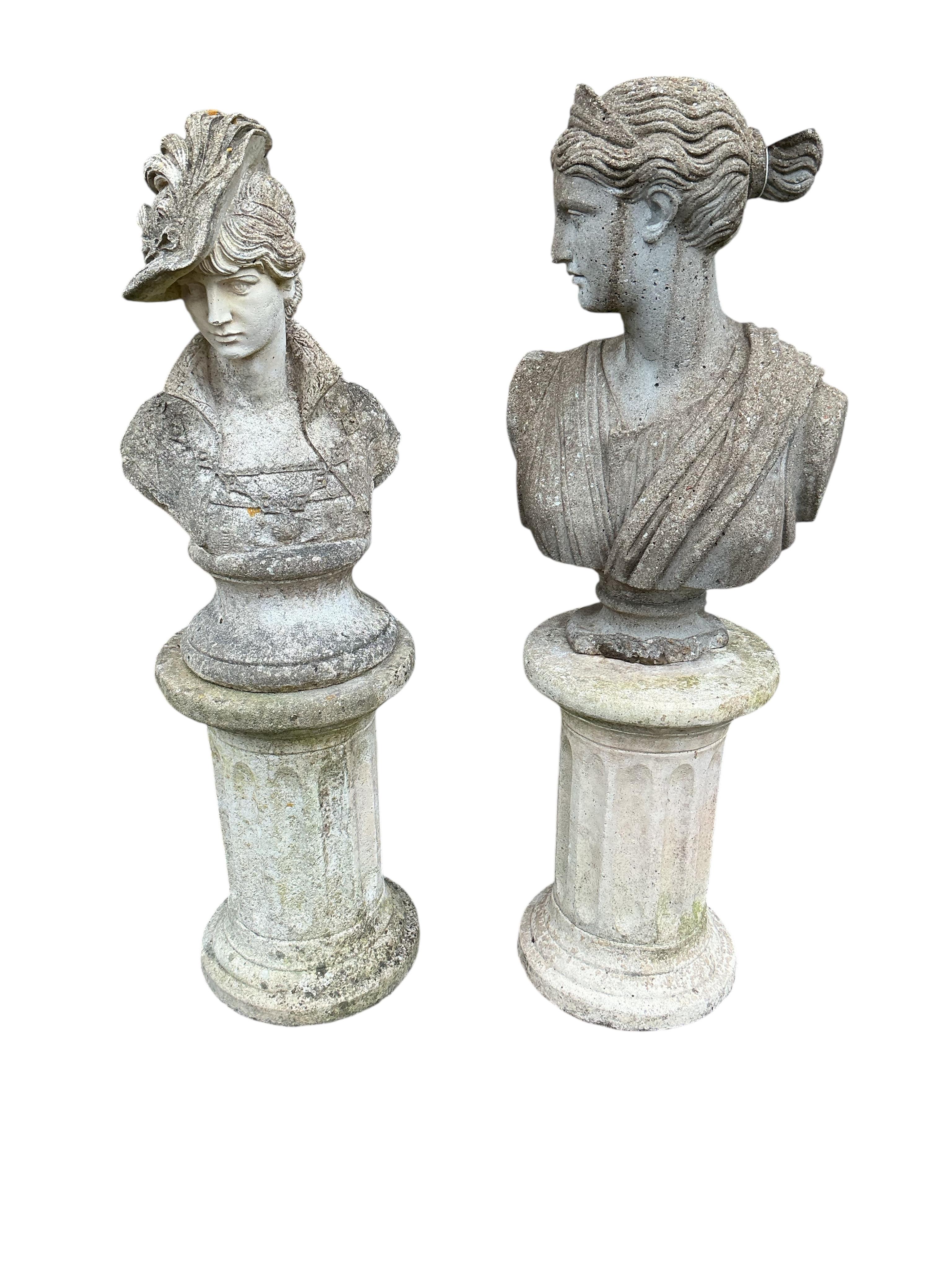 Two reconstituted stone female bust garden ornaments on fluted pillars, larger height 86cm